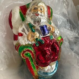 Festive Santa Claus Ornament with Red and Green Accents
